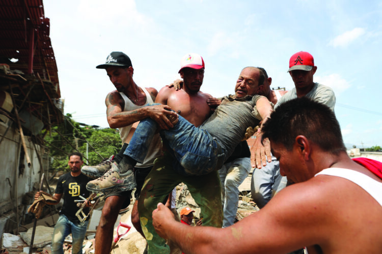 Venezuelans search rubble for survivors after 2 strong quakes kill at least 188